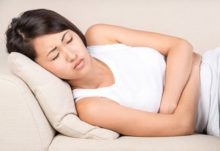 Woman suffering from diverticulitis symptoms