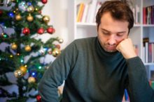 man suffering from depression during holidays