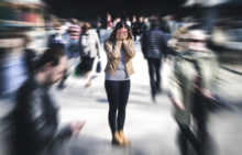 Person experiencing anxiety in a crowd