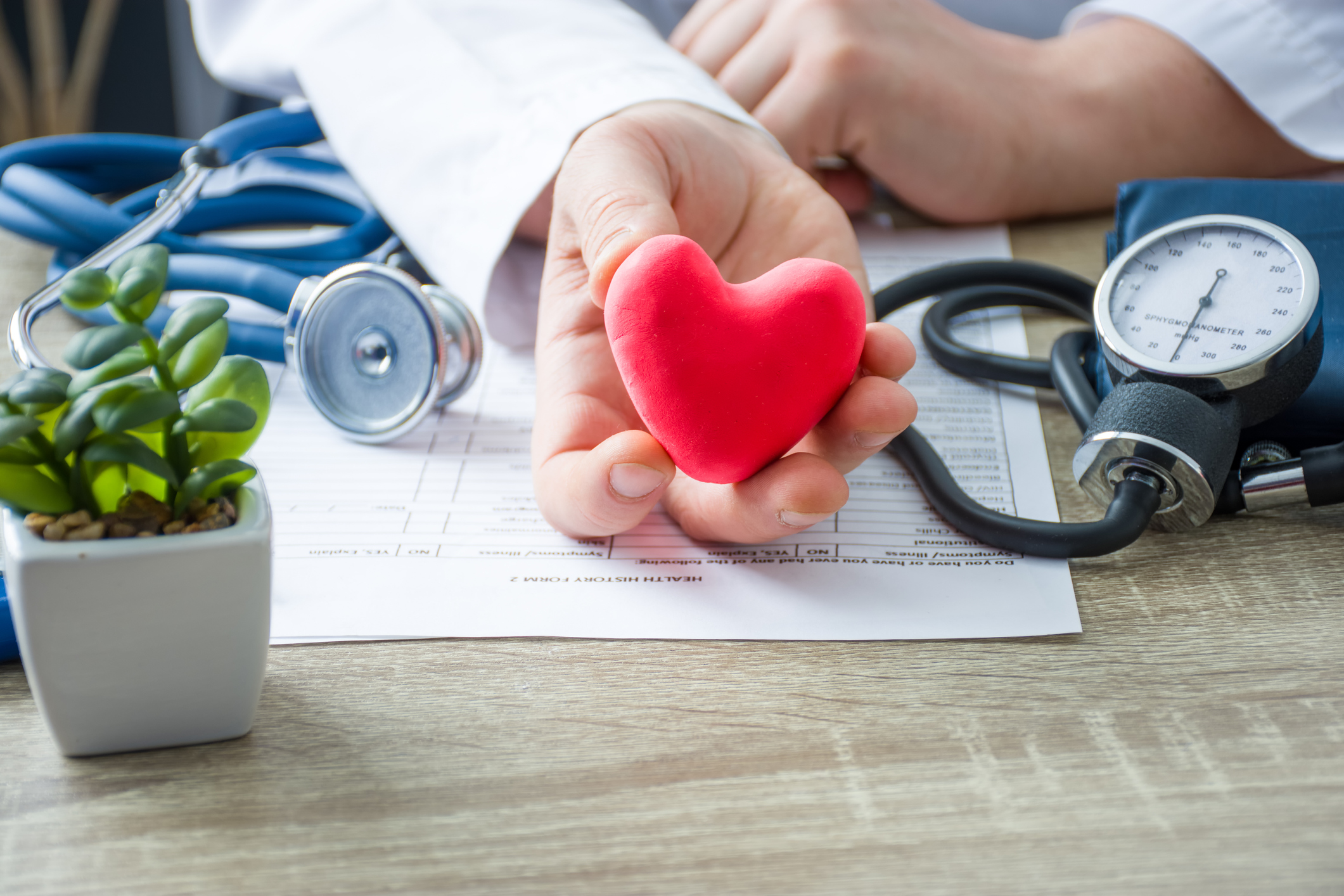 Doctor holding a heart to illustrate heart health