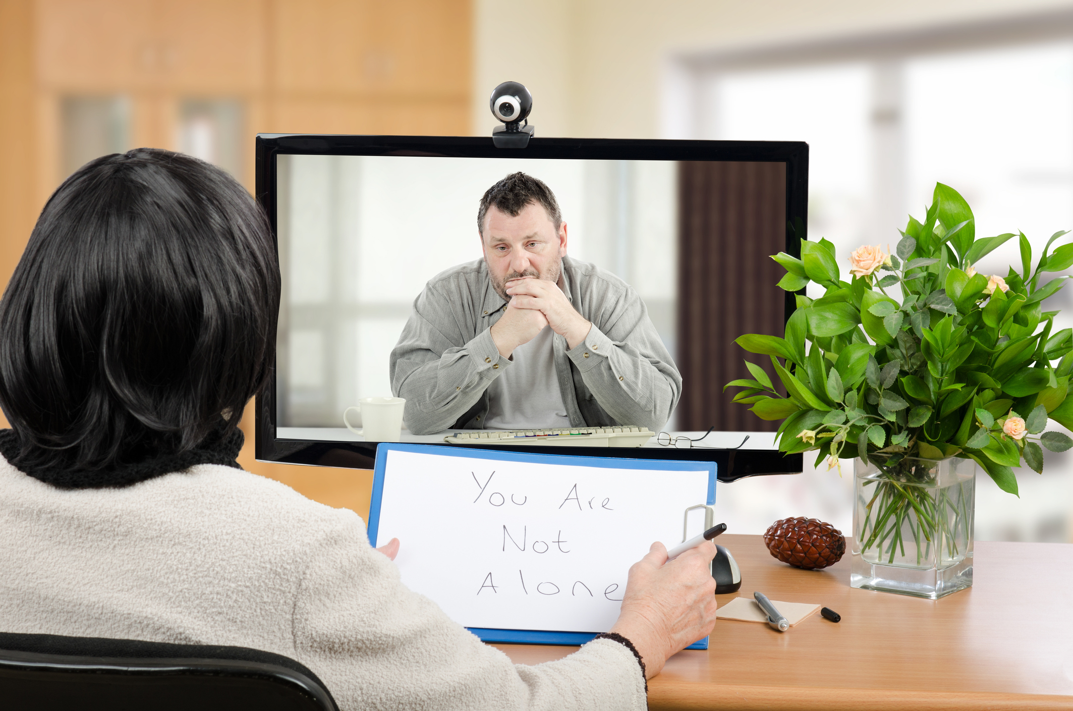 Man doing an online therapy session