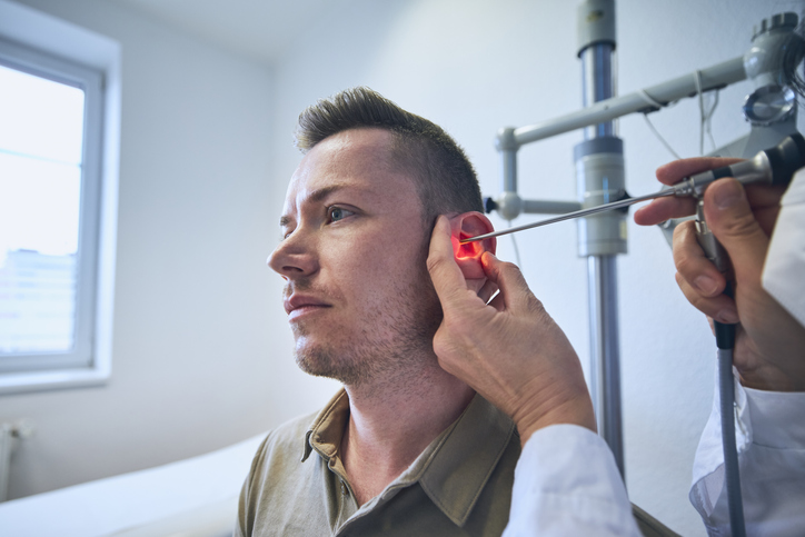 ent doctor examining tinnitus case