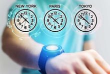 Medical person wearing smart watch displaying different time zones