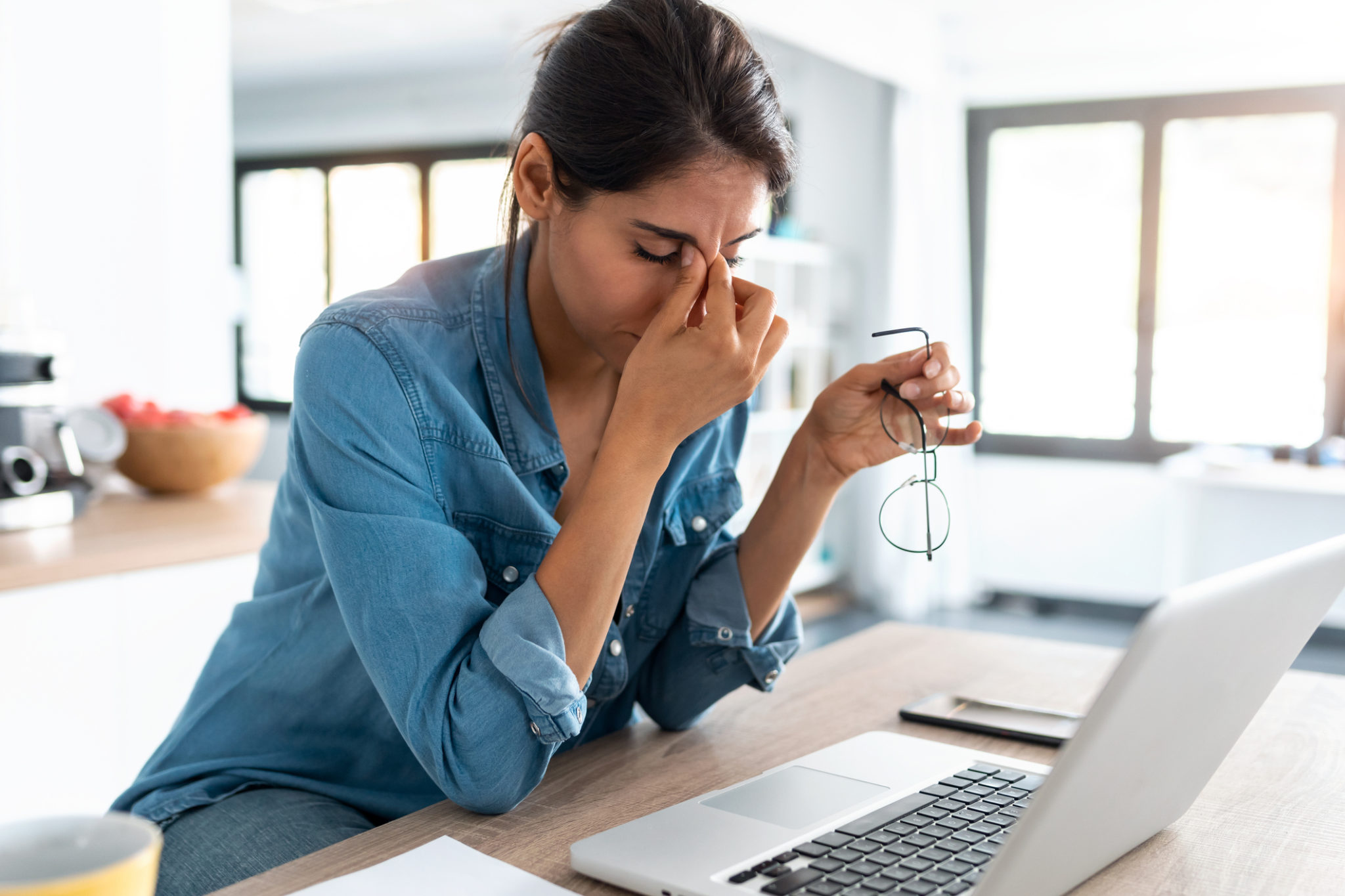 woman experiencing eye strain from computer