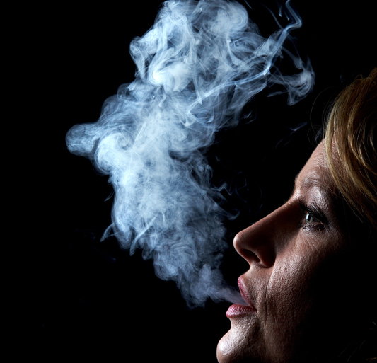 mouth cancer -- woman smoking cigarette